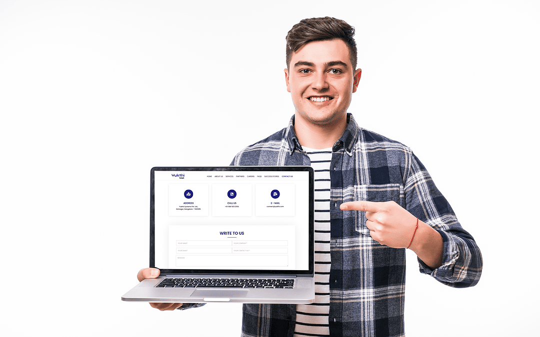 Benefits of yukthi Email Hosting shown by a young man with laptop in one hand