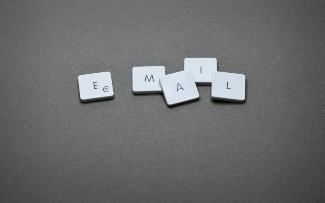 email written in five cube blocks scattered in a black surface