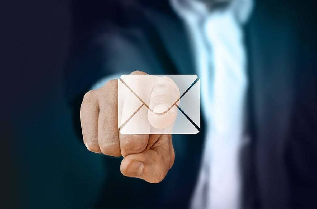 Feature image of a person holding finger at a mail symbol Proton Mail vs Yukthi Mail